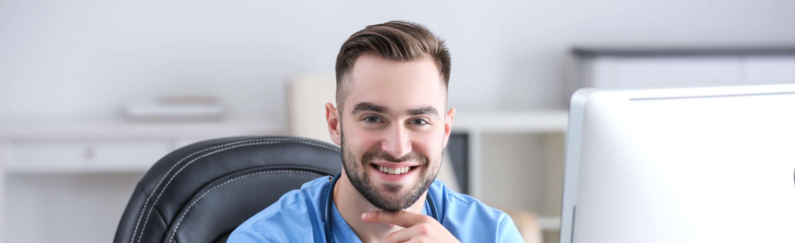 Young medical assistant working in office