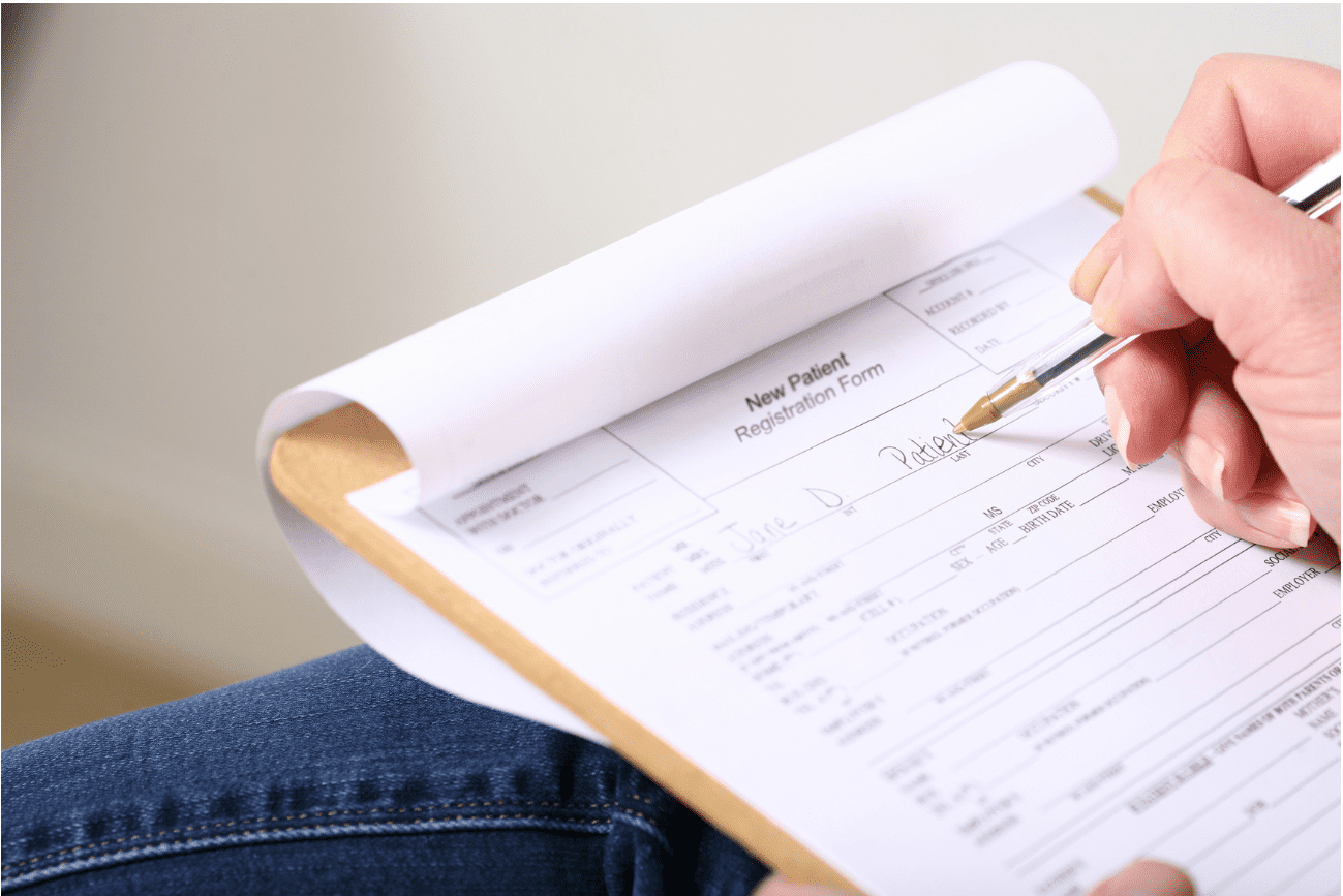 Patient filling medical forms
