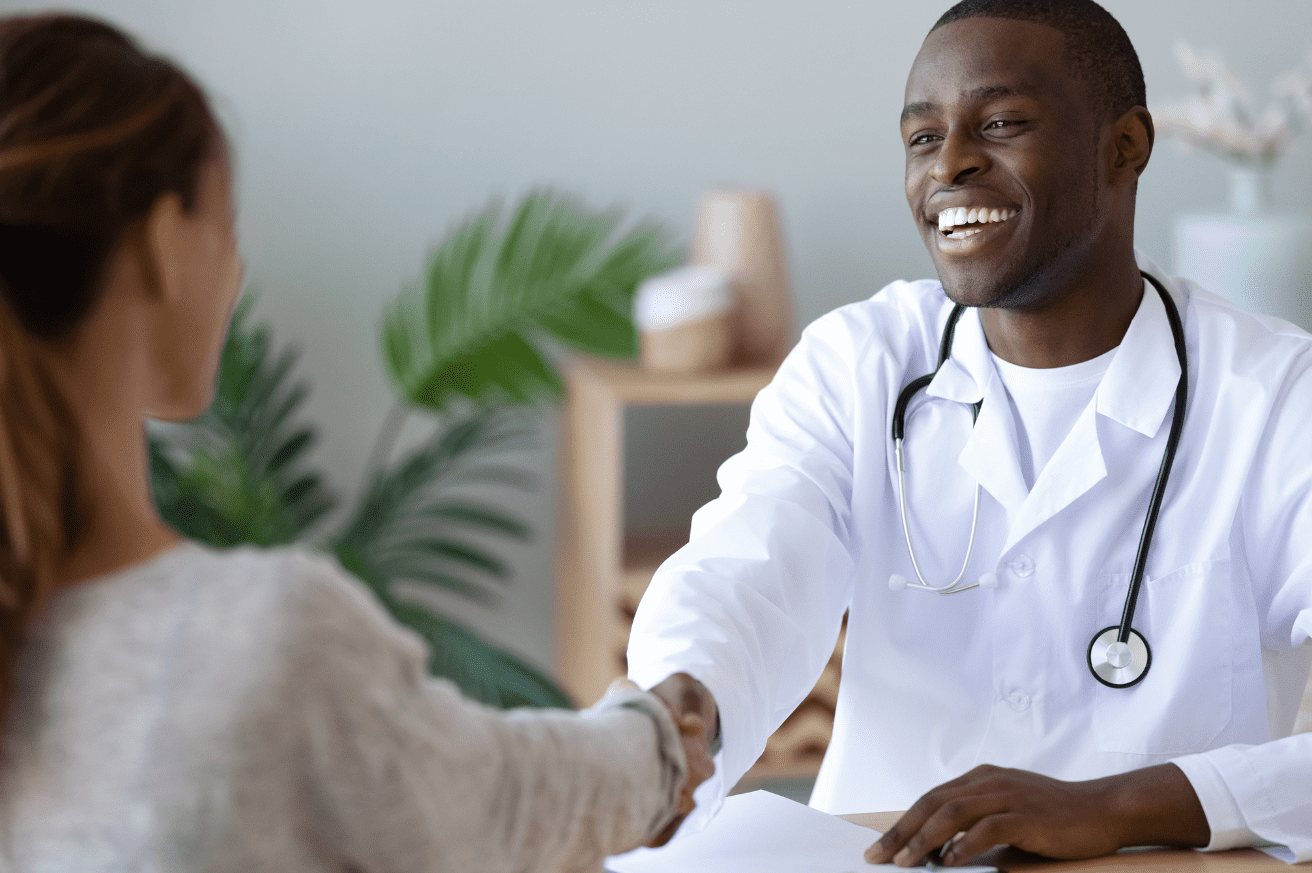 Smiling physician with patient