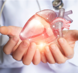 Doctor holding a glowing heart.