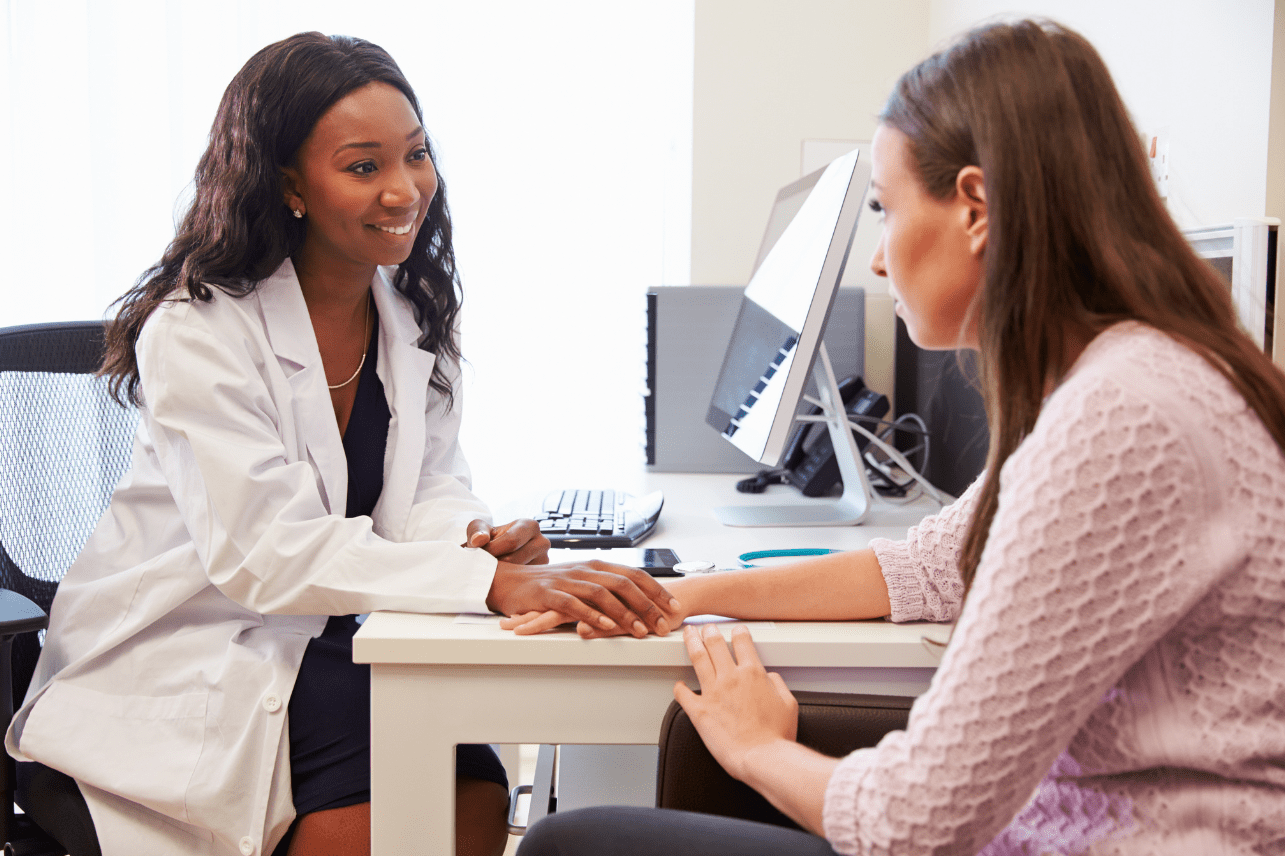 A doctor consulting a female patient