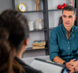 Man sits with therapist