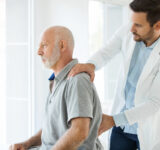 Physician checking patient for pain