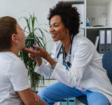 Pediatrician with child