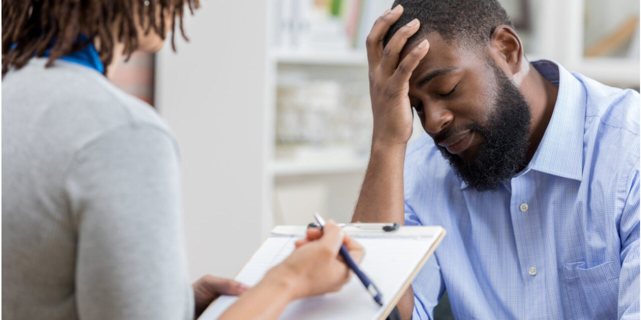 A troubled man consults with a therapist