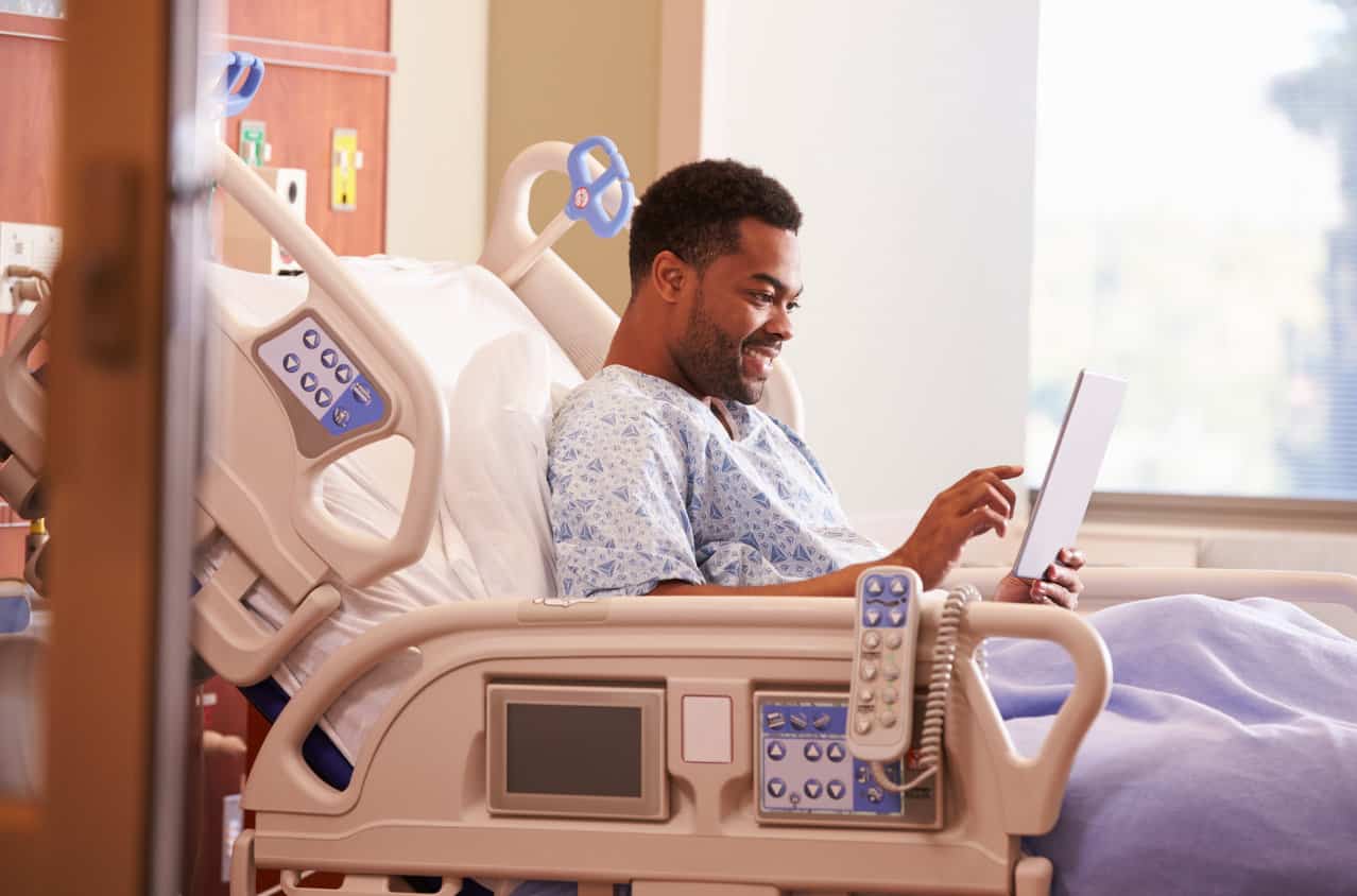 Patient in hospital bed.