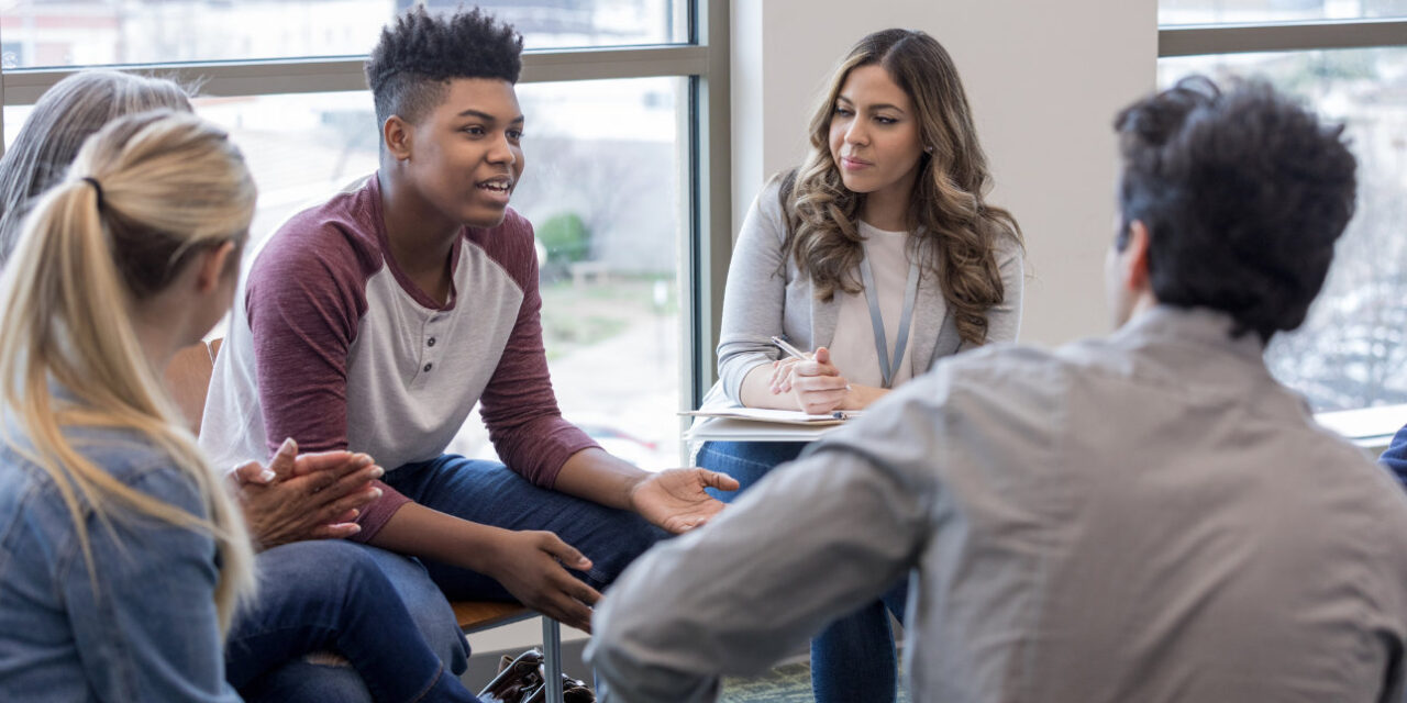 Young people in a group therapy session.