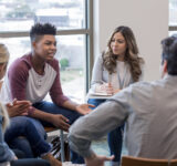 Young people in a group therapy session.