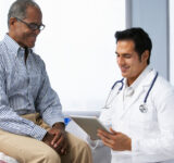 Doctor with older male patient.